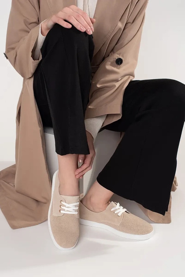 Beige sports shoes... 2