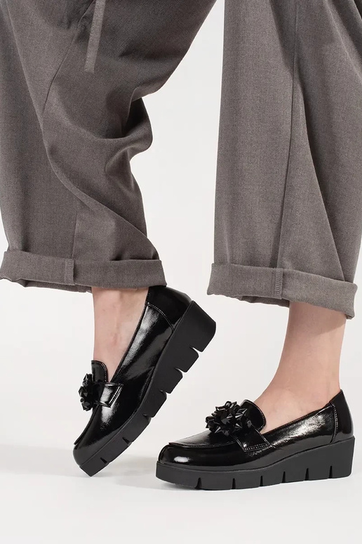 black INomens moccasins on a Inedge...