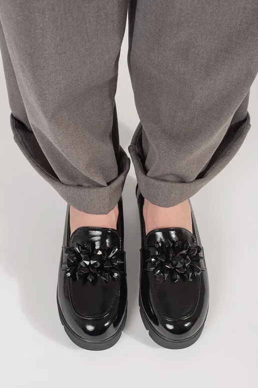 black INomens moccasins on a Inedge...