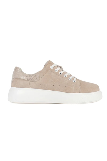 beige leather Sneakers on a...