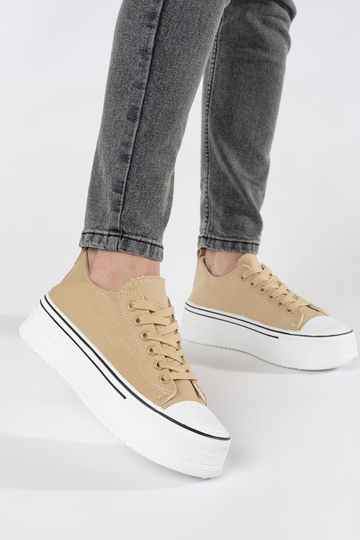 Beige sports shoes Inomens on a thick...