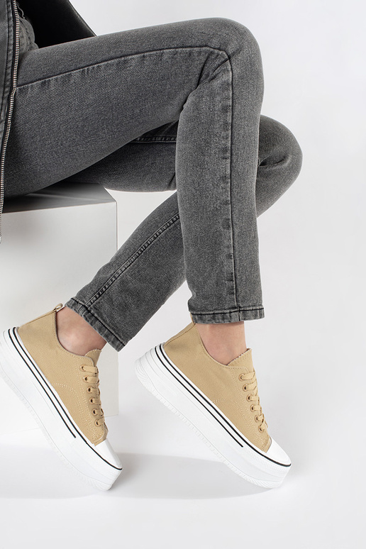 Beige sports shoes Inomens on a thick...