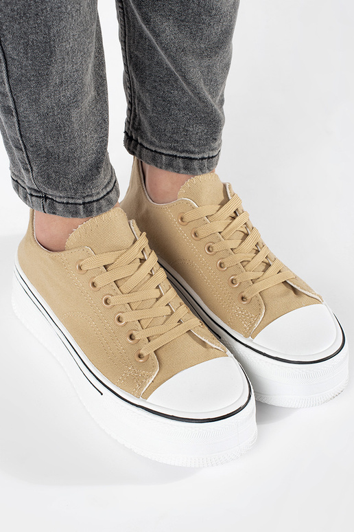 Beige sports shoes Inomens on a thick...