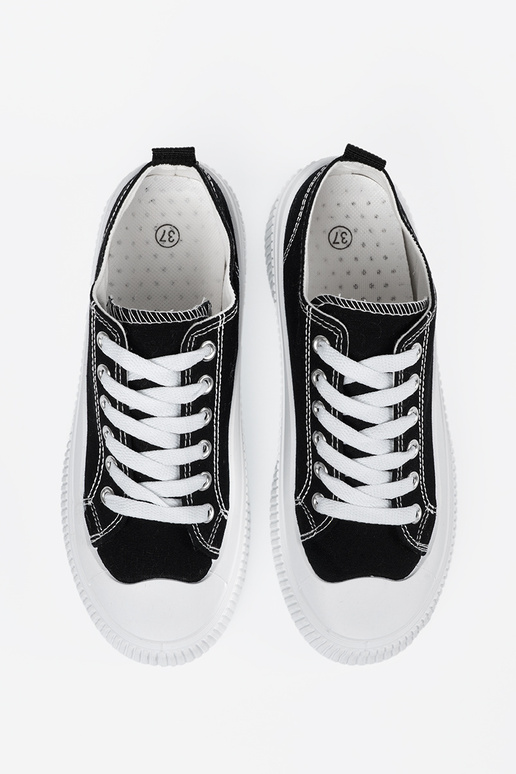 Black and-Inhite color Sneakers on a...