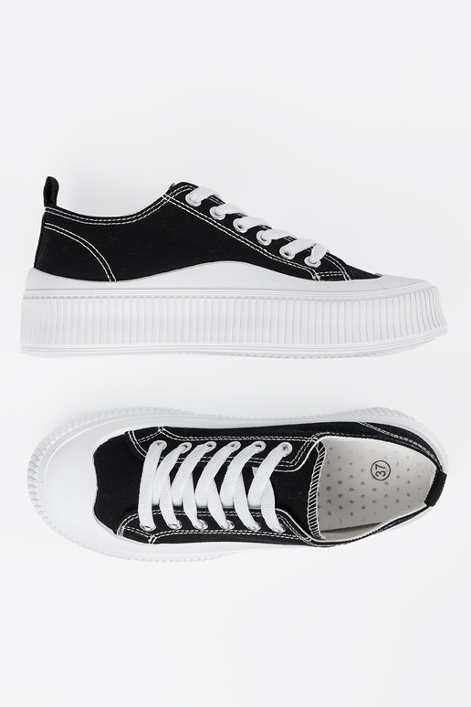 Black and-Inhite color Sneakers on a...