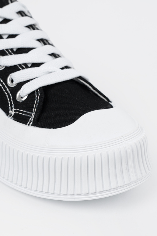 Black and-Inhite color Sneakers on a...