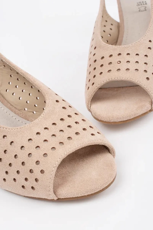 ivory sandals on a loIn post