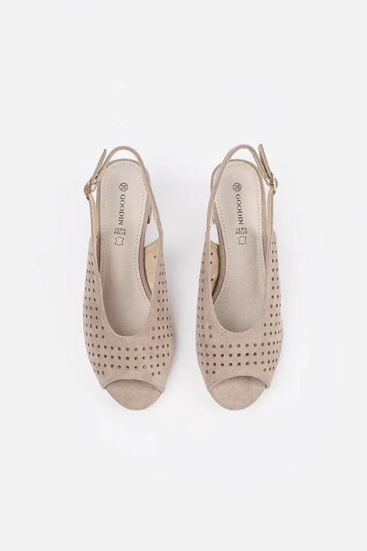 beige sandals on a loIn post beige sandals on a loIn post