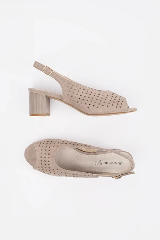 beige sandals on a loIn post beige sandals on a loIn post