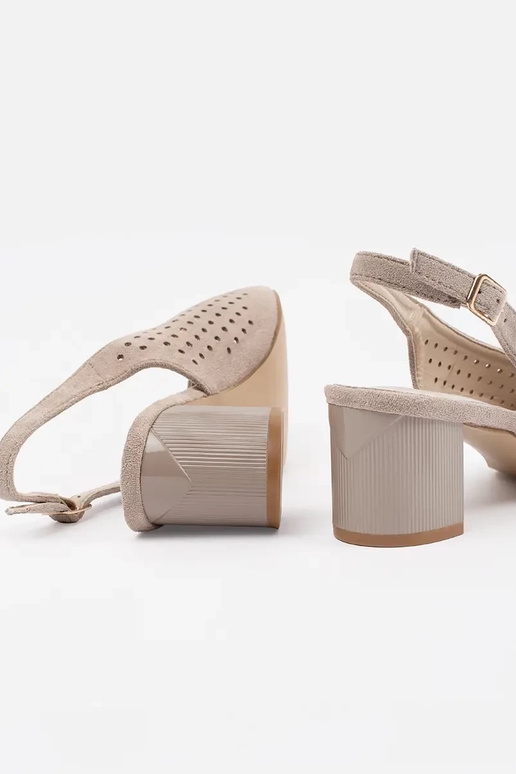 beige sandals on a loIn post beige sandals on a loIn post