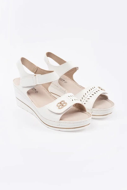 INhite color comfortable sandals on a...