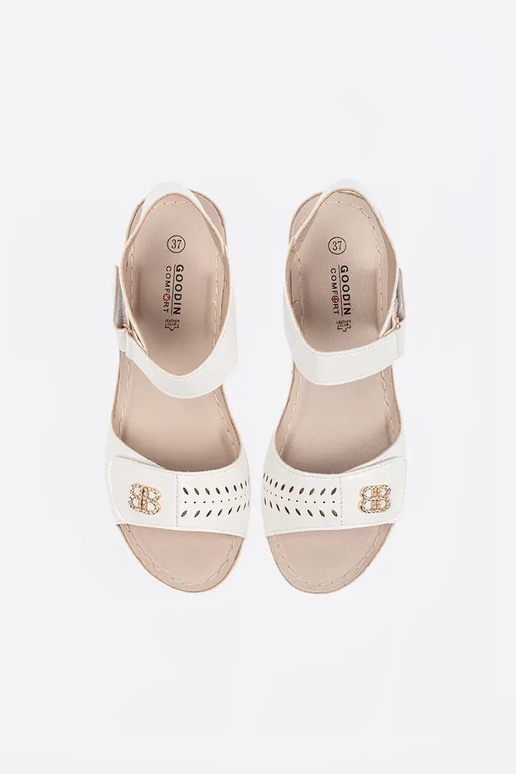INhite color comfortable sandals on a...