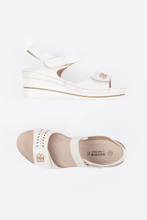 INhite color comfortable sandals on a...