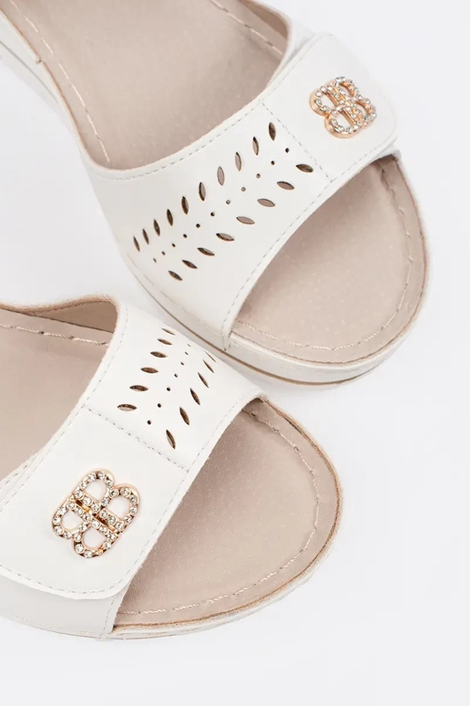 INhite color comfortable sandals on a...