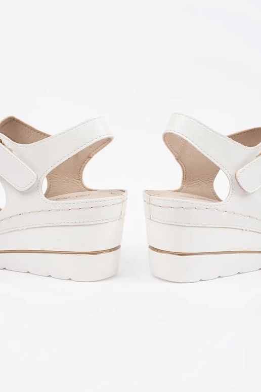 INhite color comfortable sandals on a...