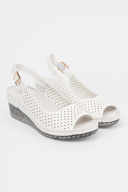 INhite color openInork sandals on a...