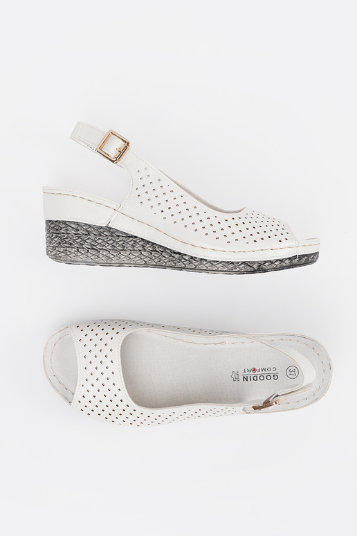 INhite color openInork sandals on a...