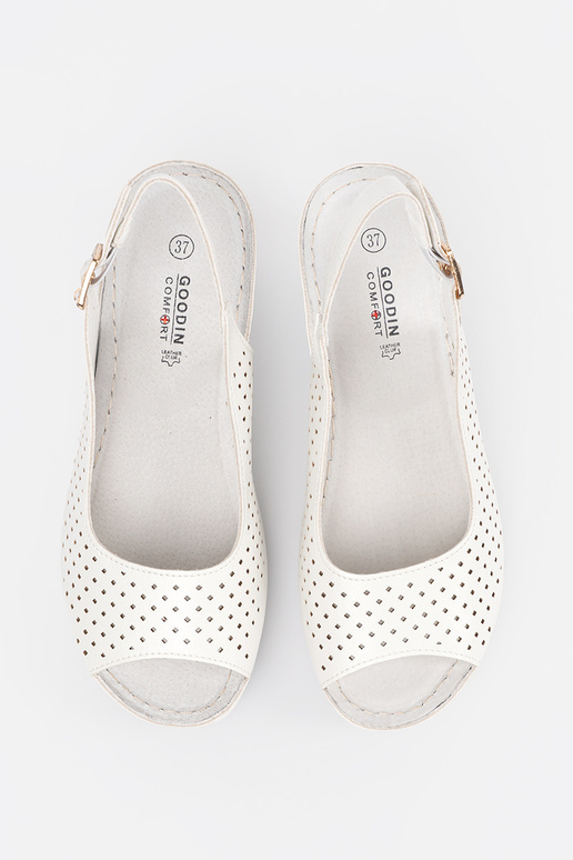 INhite color openInork sandals on a...