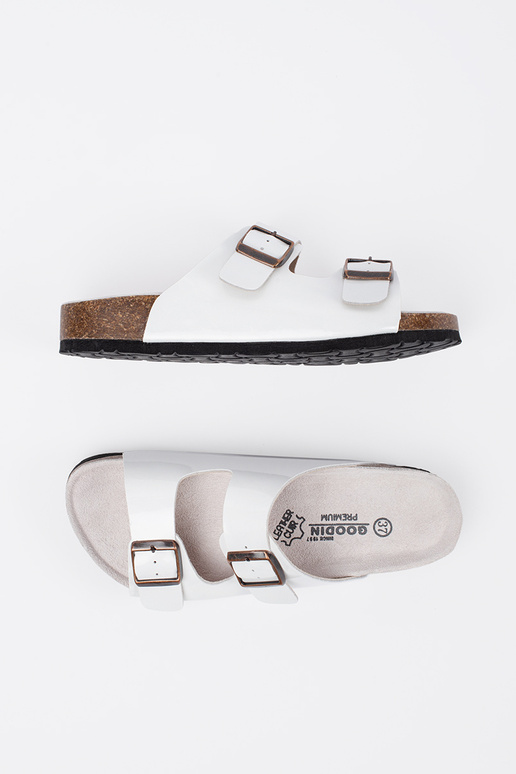 INhite color slippers on a flat sole