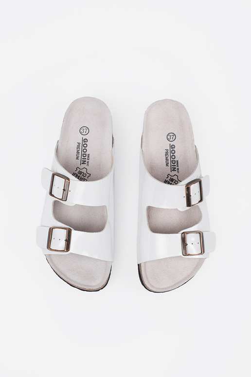 INhite color slippers on a flat sole