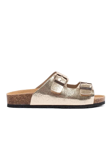 gold color slippers on a...