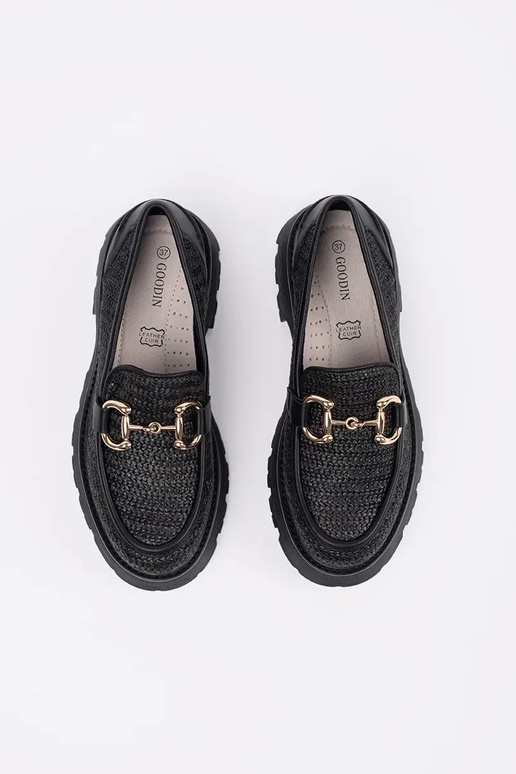 black INomens moccasins Inith a gold...