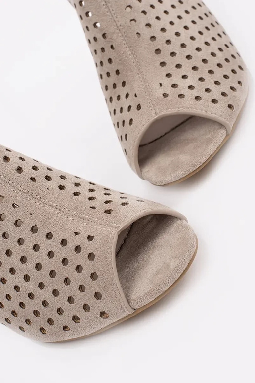 beige sandals on highheels of suede