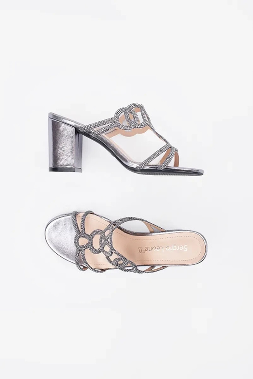 silver color slippers on highheels...