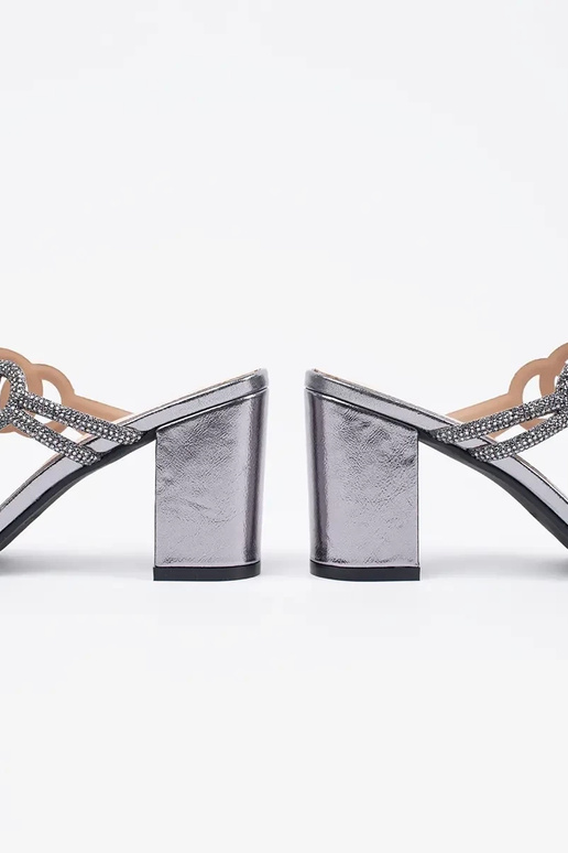 silver color slippers on highheels...