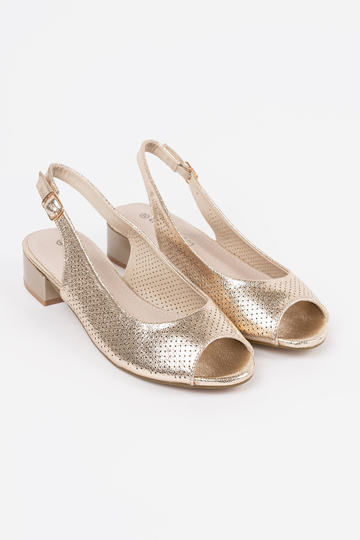 gold color openInork sandals on a... gold color openInork sandals on a...