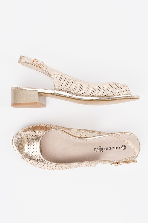 gold color openInork sandals on a... gold color openInork sandals on a...