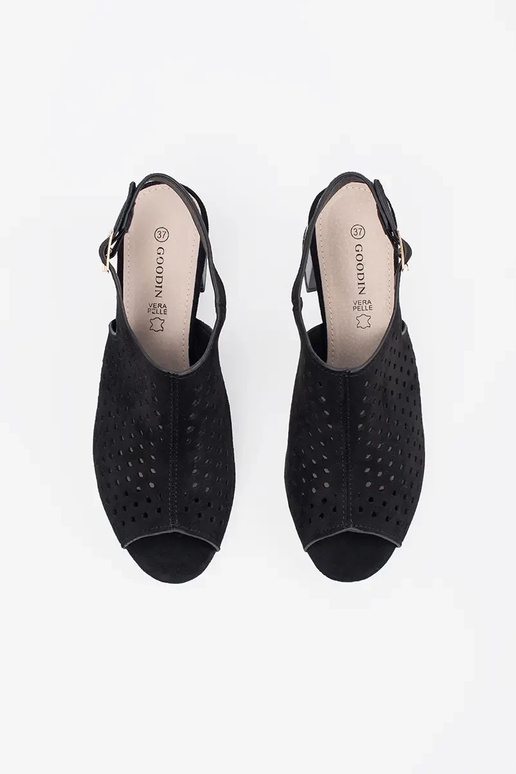 black sandals on highheels of suede