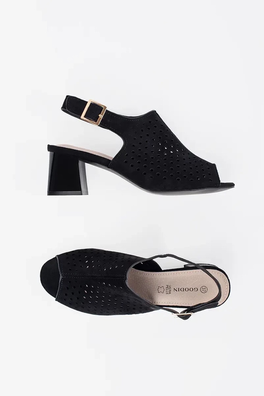 black sandals on highheels of suede