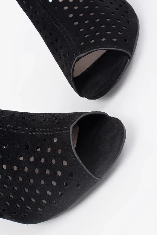 black sandals on highheels of suede