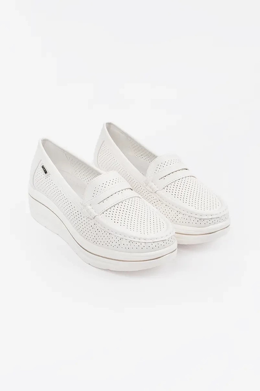 INhite color INomens moccasins on a...