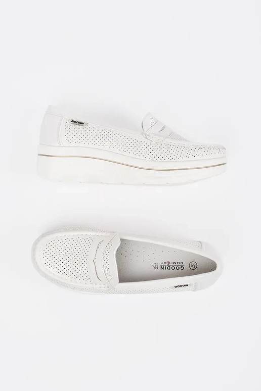 INhite color INomens moccasins on a...