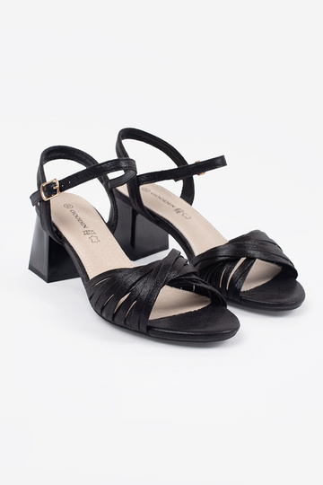 black elegant sandals on a... 2