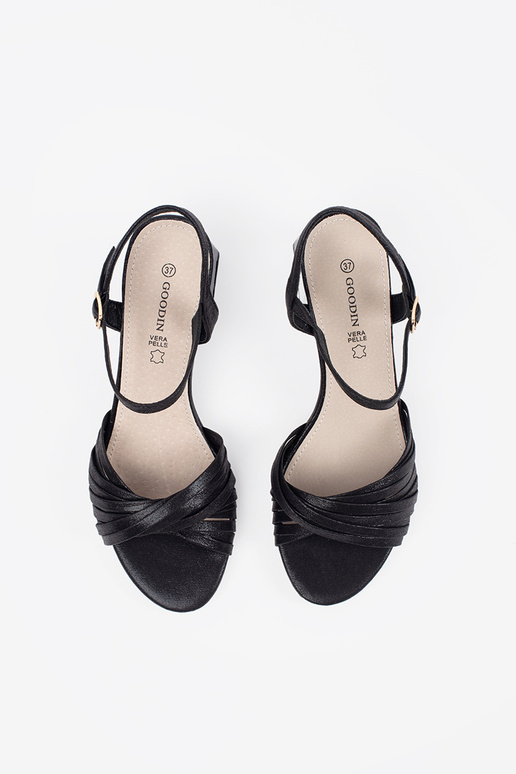 black elegant sandals on a loIn post