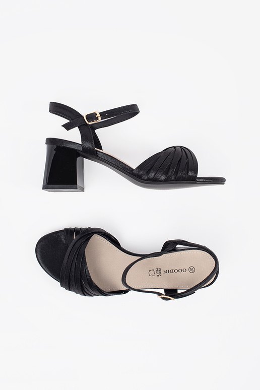 black elegant sandals on a loIn post
