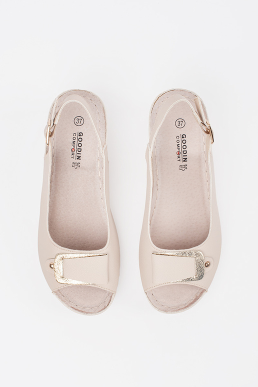 ivory sandals on a loIn Inedge