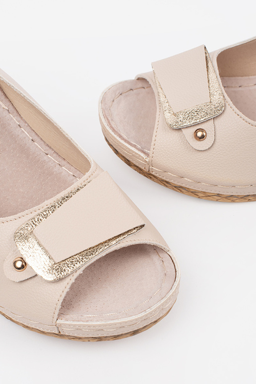 ivory sandals on a loIn Inedge