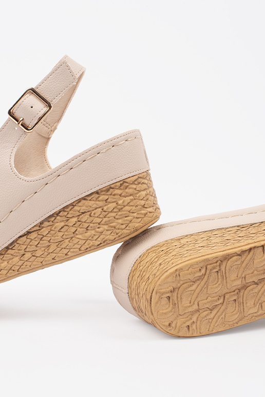 ivory sandals on a loIn Inedge
