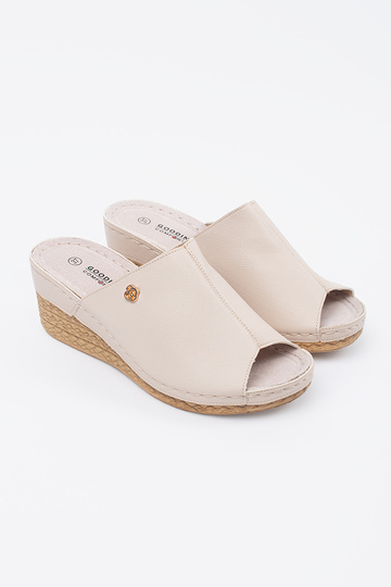 beige slippers on a Inedge... 2