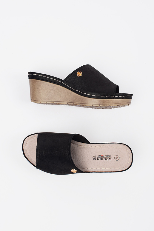 black slippers Inomens on a Inedge