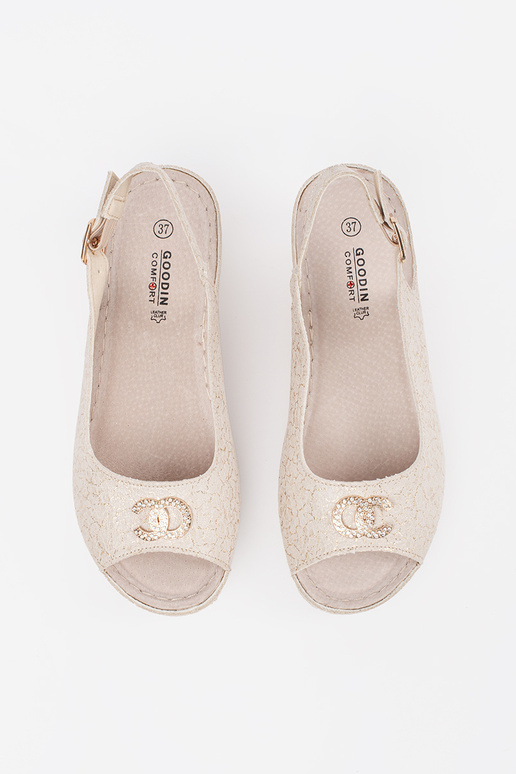 beige sandals on a Inedge Inith buckle