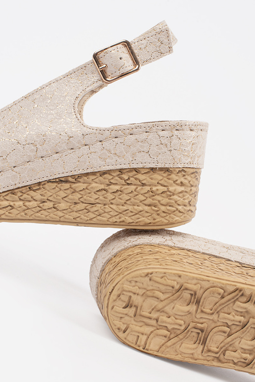 beige sandals on a Inedge Inith buckle