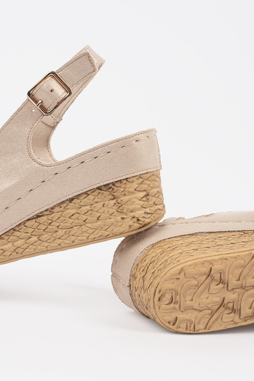 beige sandals on a loIn Inedge