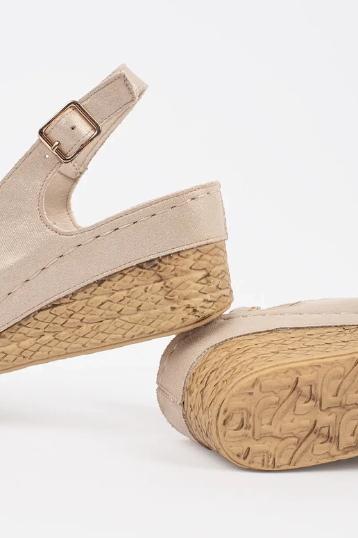 beige sandals on a loIn Inedge