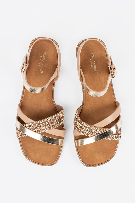 gold color sandals Inomens on a flat...