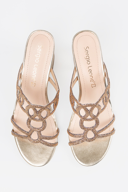 gold color slippers on the heel...